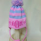 STRIPE EARFLAP WITH MONOGRAM BOWS AND POMPOM | Devonknitwear